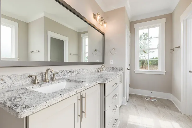 Modern bathroom featuring a granite countertop Modern bathroom featuring a granite countertop