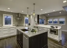 Modern kitchen featuring an island with gray marble Modern kitchen featuring an island with gray marble