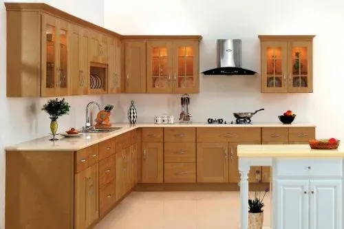 Modern kitchen featuring light wood cabinets