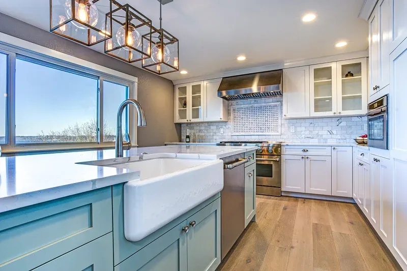 Modern kitchen featuring pastel blue cabinetry Modern kitchen featuring pastel blue cabinetry