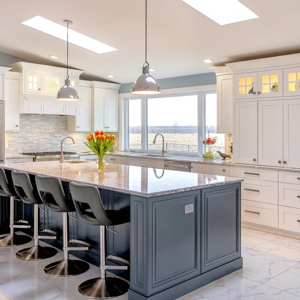 Modern kitchen with island bar stools and flowers Modern kitchen with island, bar stools, and flowers