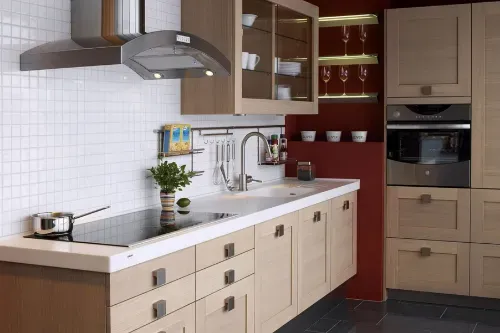 Modern kitchen with light wood cabinetry