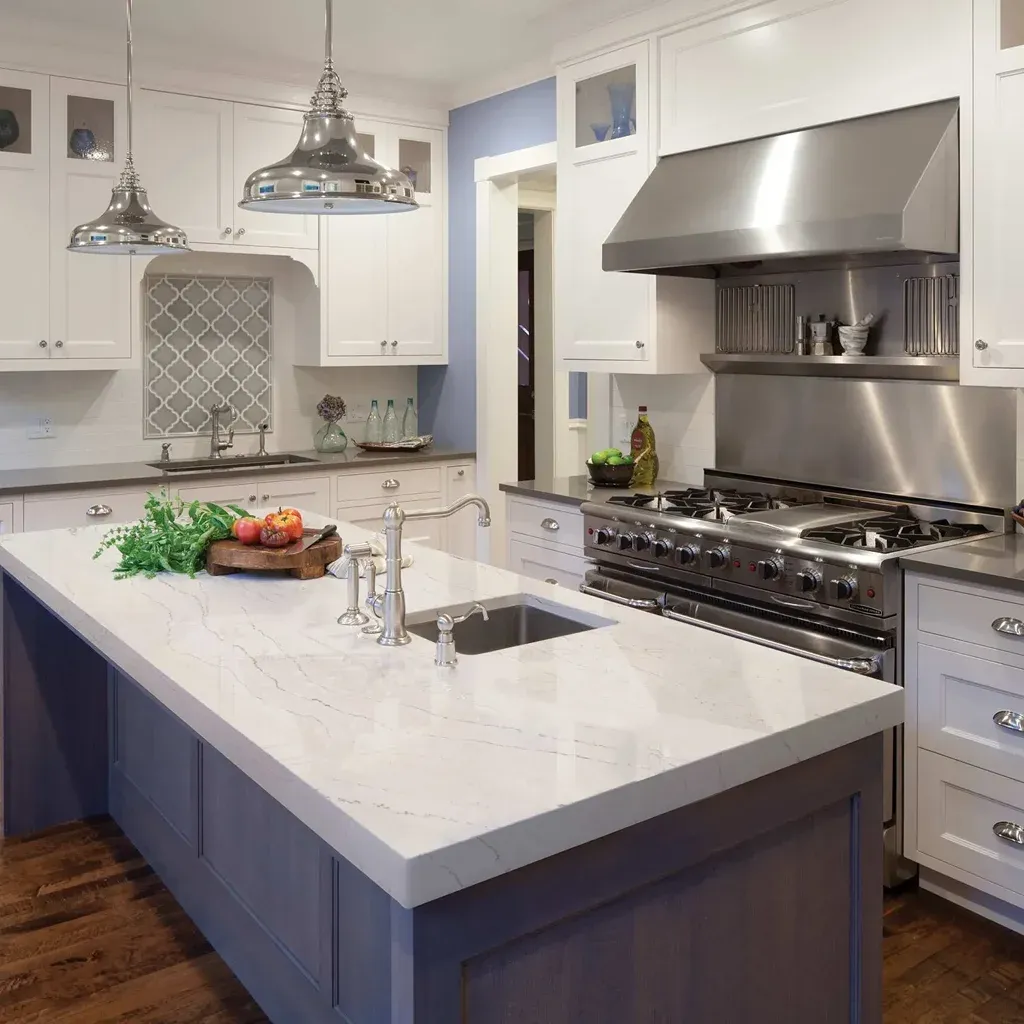 Modern kitchen with white cabinets and stainless steel appliances