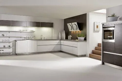 Modern kitchen with white cabinets and wooden accents