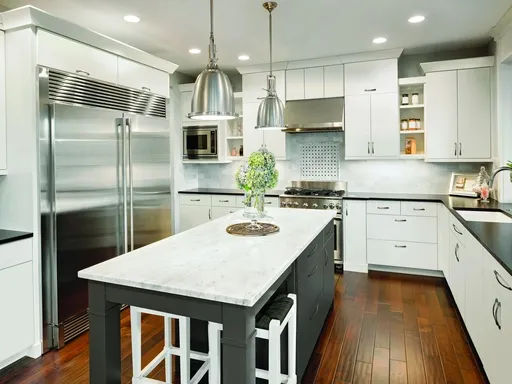 kitchen with white cabinetry stainless steel appliances kitchen with white cabinetry, stainless steel appliances